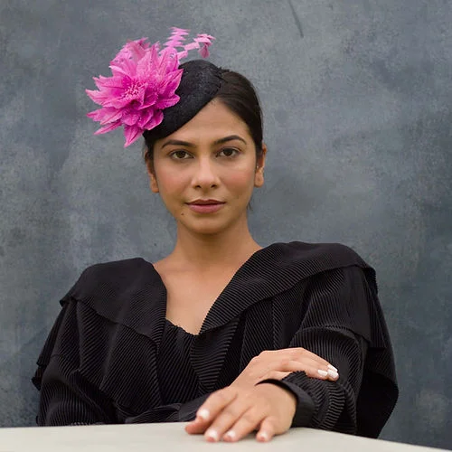 Black fascinator with fuschia flower