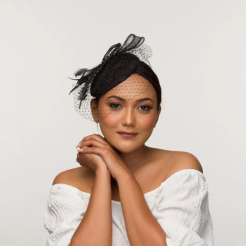 Black lace fascinator base with a delicate bow and veil