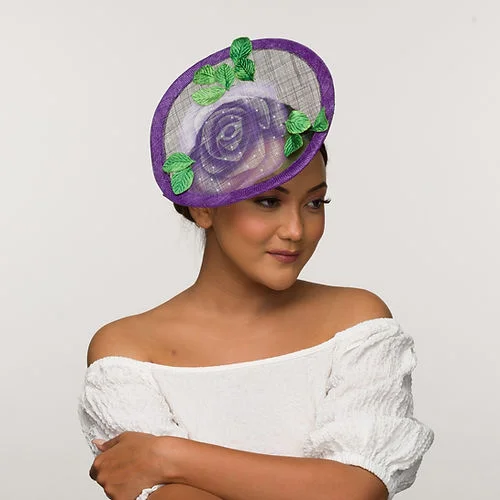 Purple fascinator base with imprinted floral trim