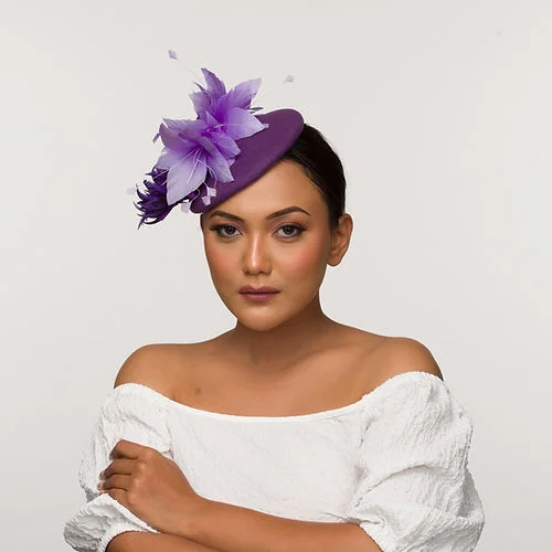 Purple felt fascinator with floral trims