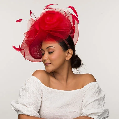 Red fascinator with feathers